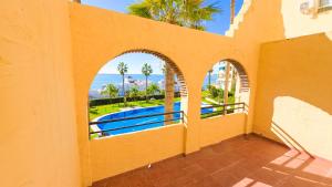 a view of the ocean from the balcony of a house at Casinomar Apartments Pool, Garden & Private Terrace in Benalmádena