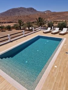 a swimming pool with a view of the desert at Casa Abuela Serapia in Tuineje