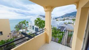 a balcony with a view of the ocean at Casinomar Apartments Pool, Garden & Private Terrace in Benalmádena