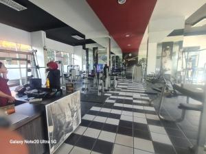 a restaurant with a black and white checkered floor at Mountain View at The Edge in Cimindi-hilir