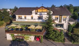 an overhead view of a restaurant with a building at Hotel-Restaurant Lindenhof in Kreuzwertheim +31 photos