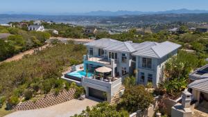 an aerial view of a house with a swimming pool at SL9 - Pezula Double Storey Luxury in Knysna