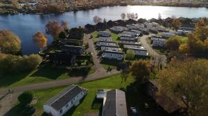 an aerial view of a row of houses next to a river at Goaty Lodge - 2 The Green in Tattershall