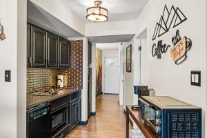 a kitchen with a counter top and a microwave at Stylish 1BR Free Attraction Tix Views! in Gatlinburg