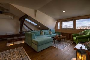 a living room with a couch and a table at Apartments Salim in Sarajevo