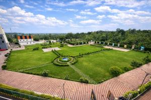 an aerial view of a park with a large lawn at Green Mountain Resort in Guna
