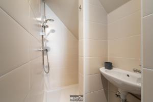 a bathroom with a shower and a sink at Maison Beluga - spacious apartment in Westende in Middelkerke +19 photos