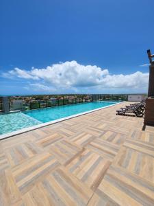 a swimming pool on the roof of a building at Apartamento Edifíco Prestige in Marechal Deodoro