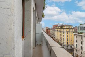 a balcony with a view of a city at Welcome Foresteria Lombarda in Milan