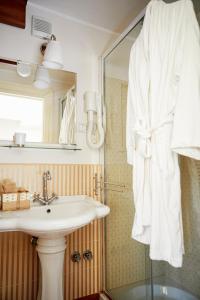 a bathroom with a sink and a mirror at GOLA Dimora storica in Cerignola +68 photos