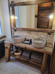 two sinks on a wooden table in a bathroom at Le Loft Des Arts in Thonon-les-Bains
