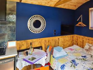 a bedroom with a bed and a counter with a table at Badgers - Uk46750 in Herstmonceux