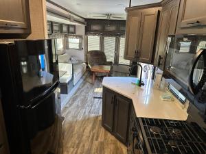 a kitchen and living room of an rv at Big Pine Key RV Park in Big Pine Key