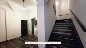 an empty hallway with stairs in a building at Poesia - By Ligooria in Pietra Ligure
