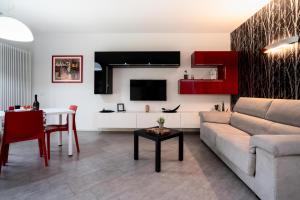 a living room with a couch and a table at Il Sogno di Elisa in Trivignano +26 photos
