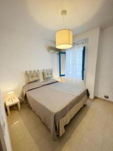 a bedroom with a large bed in a room at Villa Marzamemi in Marzamemi