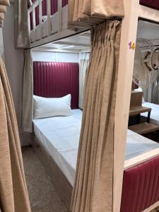a couple of bunk beds in a room at Rajal Dormitory in Indore