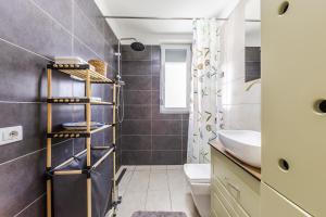 a bathroom with a sink and a toilet and a shower at Talea Joyful Stay by PikHost in Lezhë +32 photos