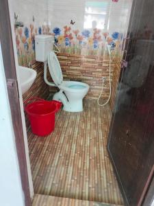 a bathroom with a toilet and a sink at Beach Times Resort in Kottakupam +48 photos