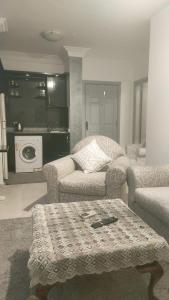 a living room with a couch and a table at Sharm life 106 in Sharm El Sheikh