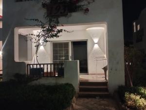 a house with a staircase leading to a window at Sharm life 106 in Sharm El Sheikh