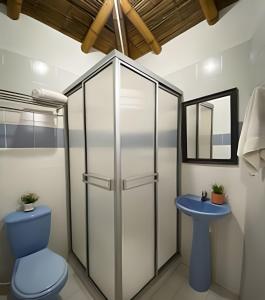 a bathroom with a toilet and a sink at FINCA HOTEL DON JULIO in Santa Rosa de Cabal +85 photos