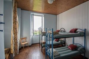 a room with three bunk beds and a window at Quadrifoglio Center in Ameno +23 photos