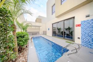 an image of a swimming pool in a house at 3BR Amazing Villa - Private Pool - 3WC - BBQ Pit in Sharjah