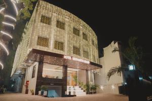 a building with lights on it at night at Hotel Siddharth Grand in Varanasi