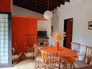 a dining room with a table and chairs at Arcadia in Merlo