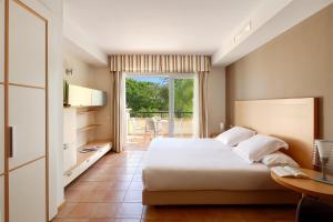 a hotel room with a bed and a balcony at Elviria Hills Living in Marbella +32 photos