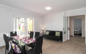a dining room with a table and a couch at Sa Gola in Canyamel +24 photos