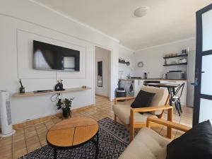 a living room with a couch and a table at 22 On Schwester Frieda in Swakopmund