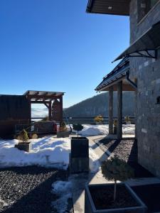 a gazebo with snow on the ground at Domek w Chmurach II in Kicznia