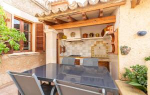 an outdoor kitchen with a table and chairs at Los Abilios in Palma de Mallorca +39 photos