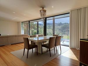 a dining room with a table and chairs at Casa da Merelhe in Marco de Canaveses