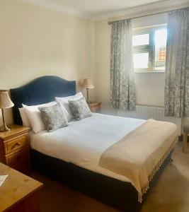 a bedroom with a large bed and a window at Seashore Lodge Guesthouse in Galway