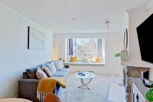 a living room with a couch and a table at Town Plaza 427 in Whistler