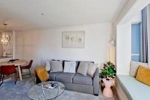 a living room with a couch and a table at Town Plaza 427 in Whistler