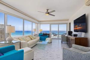 a living room with a view of the ocean at #Marbella Lane - Luxe 2BR with Panoramic Ocean View in Honolulu