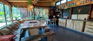 a living room with a couch and a table at Cabañas Los Volcanes Ensenada Puerto Varas in La Ensenada