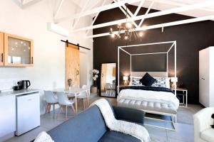 a bedroom with a large bed and a living room at Hilton Cottage in Hilton