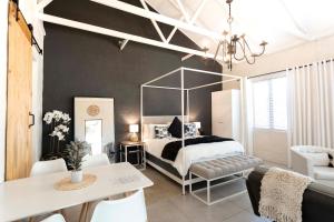 a bedroom with a bed with a large mirror at Hilton Cottage in Hilton