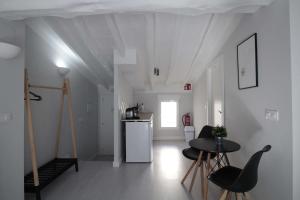 a kitchen with a table and chairs in a room at Jome Stays La Nucía in La Nucía +44 photos