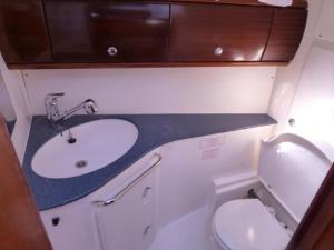 a small bathroom with a sink and a toilet at Veronica in Lefkada