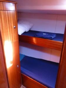 a room with two bunk beds in a boat at Veronica in Lefkada