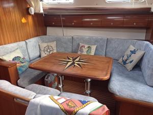 a living room with a couch and a table at Veronica in Lefkada