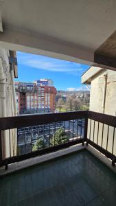 a balcony with a view of a city at HTH Apartments in Center of Gjakova - 4th Floor in Gjakove