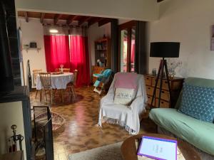 a living room with a couch and a table at Au p’tit paradis in Fresse