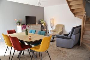 a dining room with a table and chairs at Au logis de Bayard in Vareilles